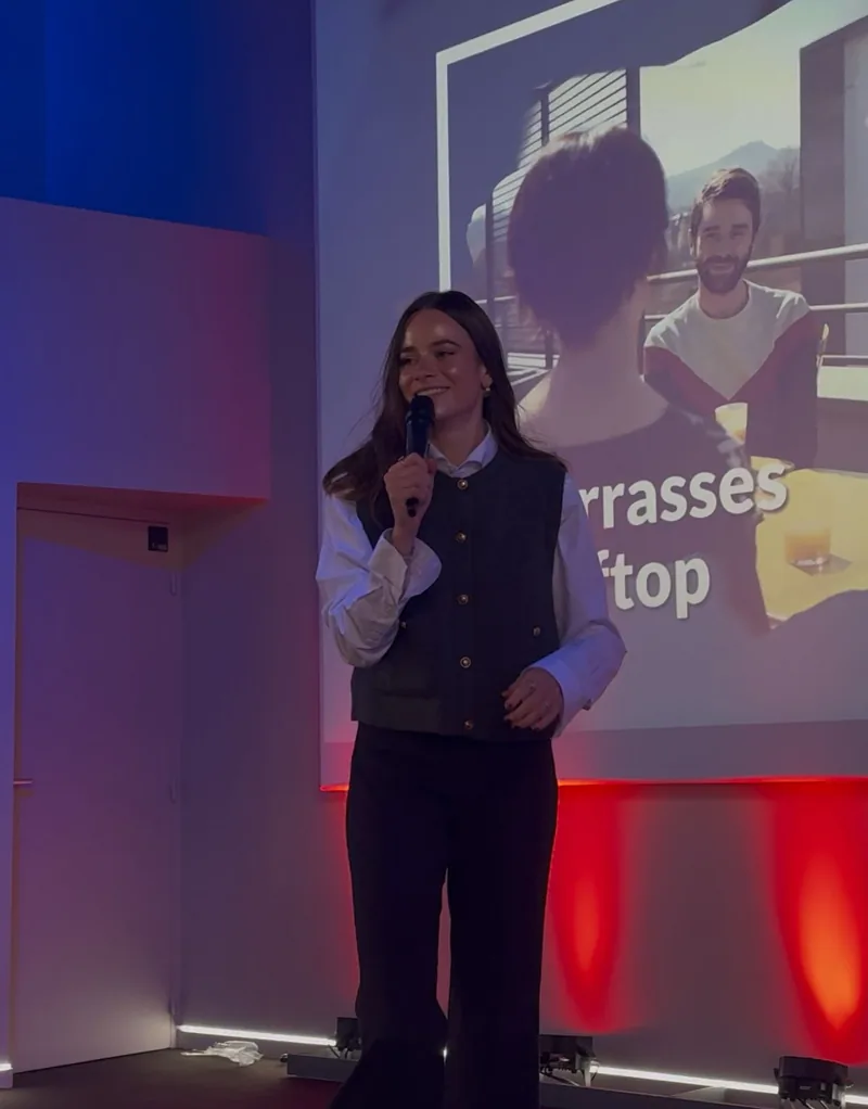 Xelence team member presenting on stage